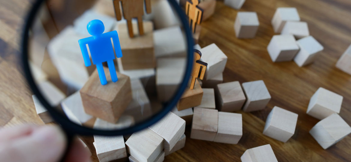 Businessman hold in hand magnifying glass